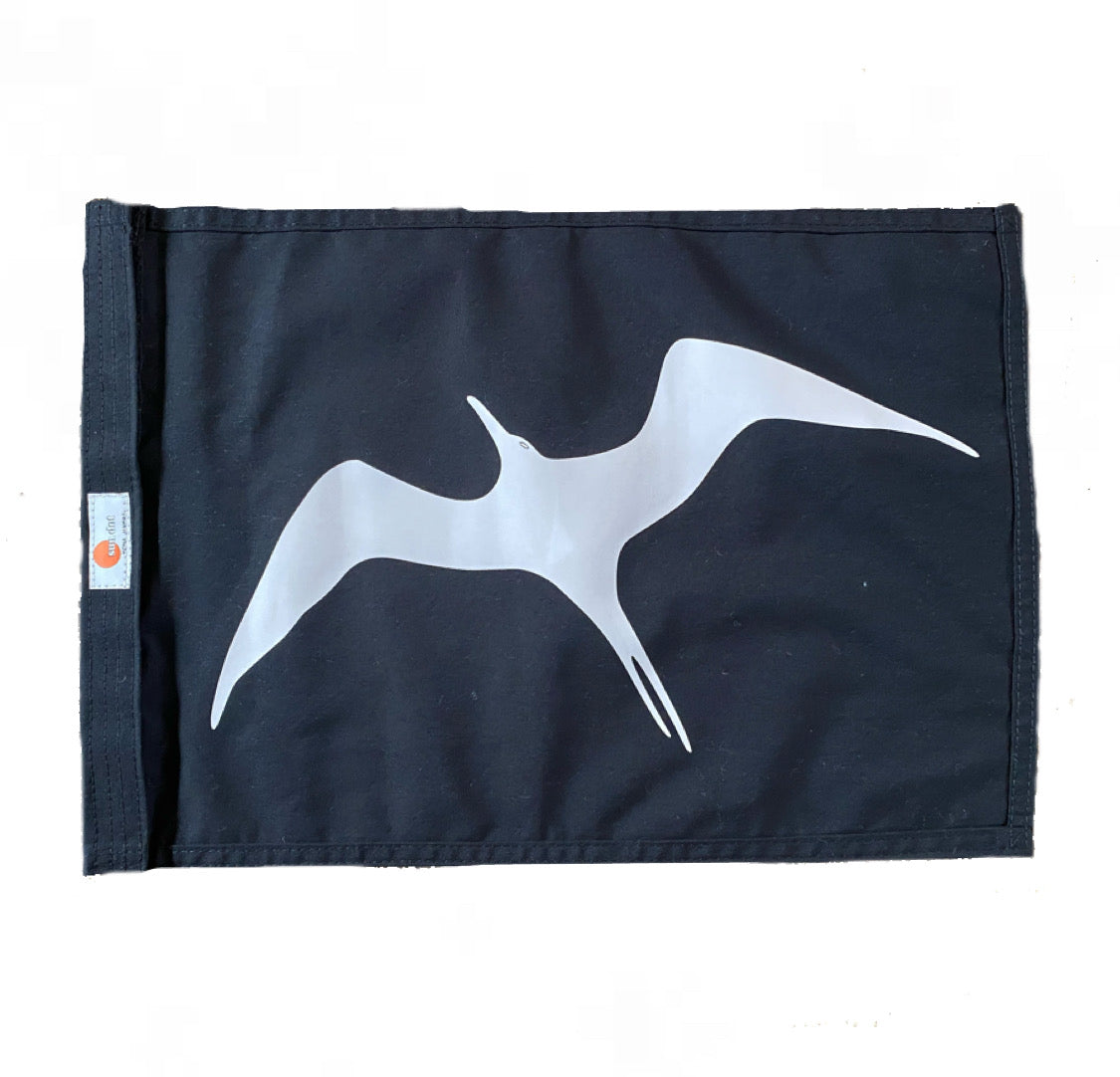 This marine capture flag is black with a white 'iwa bird or great frigate bird screened on both sides of the flag. The flag features velcro attatchment on the left hand side and measures 12x18 inches or 16x24 inches.